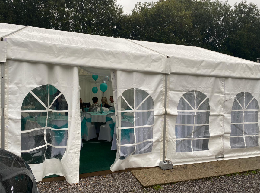 white marquee with door open
