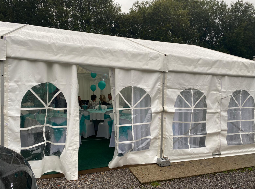 white marquee with door open